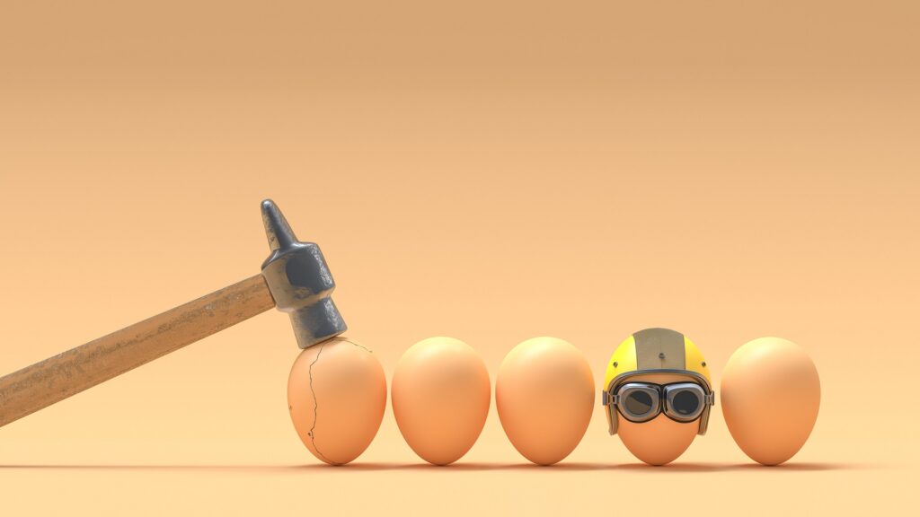 line up of brown eggs with hammer and helmet