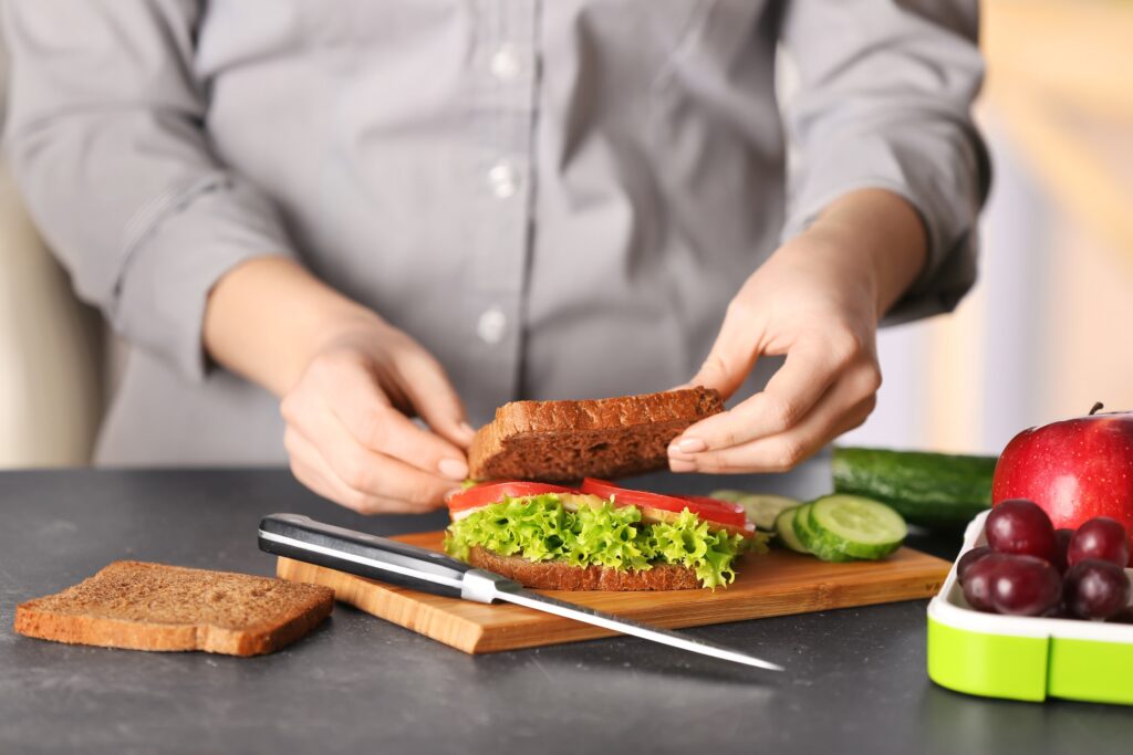 preparing breakfast sandwich on kitchen counter