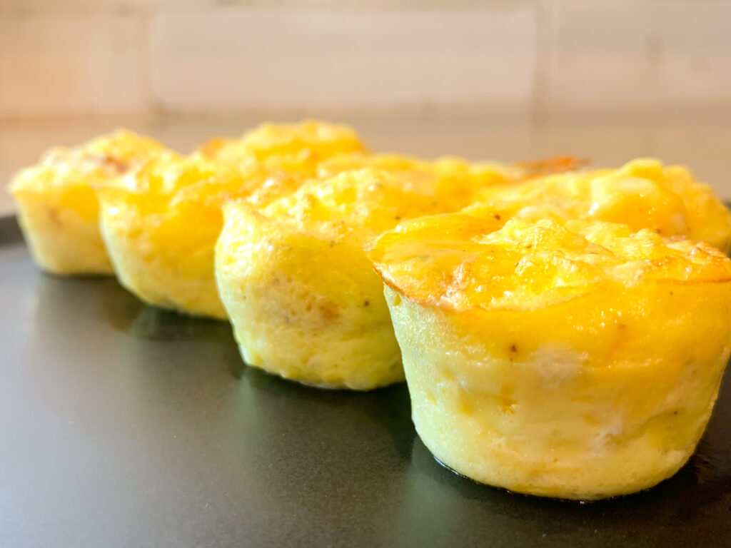 Starbucks Egg Bites lined up on black plate