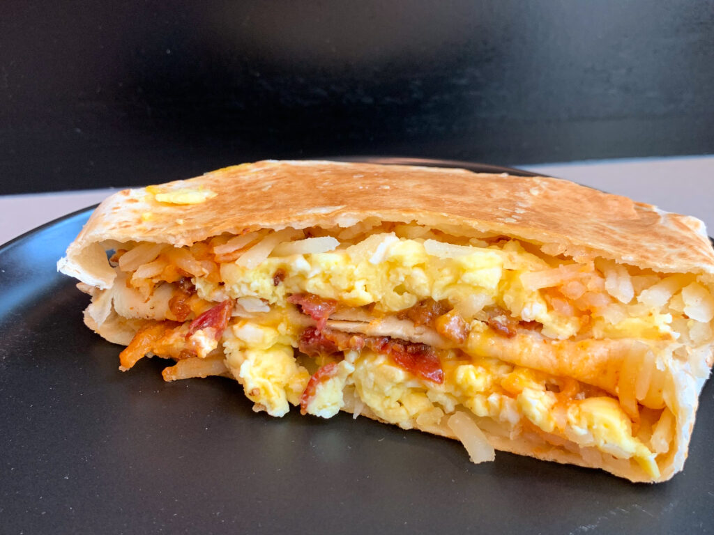 Taco Bell Breakfast Crunchwrap on black plate